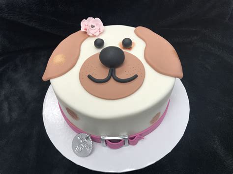 Puppy cake - Microwave and stir frequently until the texture is lightly whipped cream (20 – 30 seconds) so you can smoothly coat the cake heart and the excess frosting can drip back into bowl. Microwave 5 – 10 seconds more as needed if frosting becomes too thick for dipping. Place dipped heart on wire rack or wax paper to set.